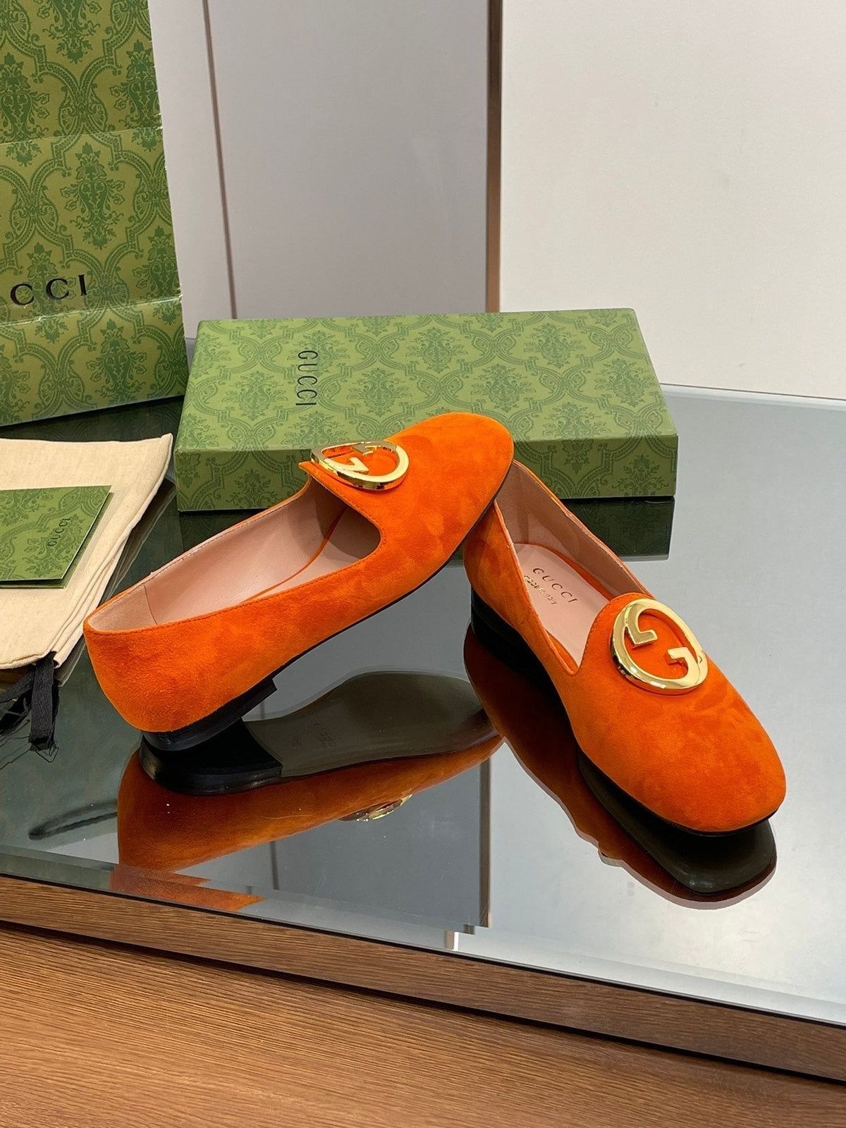 BLONDIE LOGO-PLAQUE LOAFERS IN TIGER ORANGE SUEDE