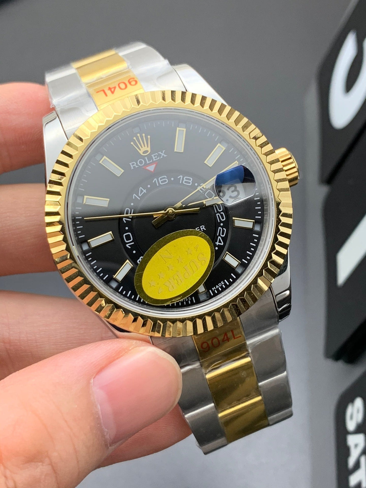 SKY DWELLER GOLD STEEL BLACK DIAL